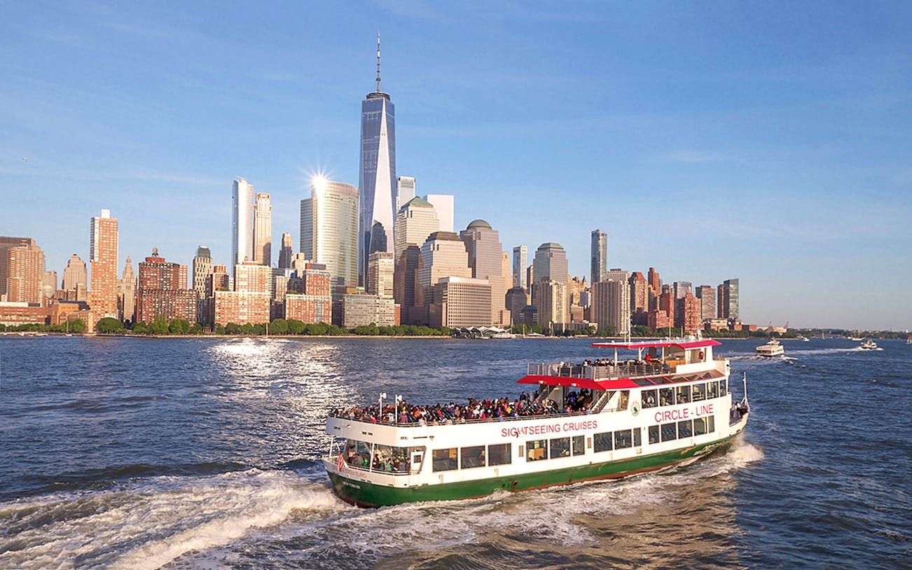 Circle Line cruise with view of New York City skyline and Empire State Building.