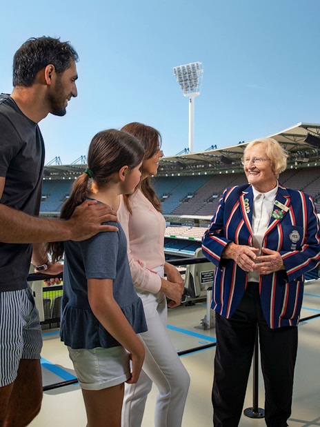 Tour group with guide at Melbourne Cricket Ground stadium.