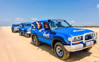 Four-wheel drive tour on K'gari beach, Fraser Island.