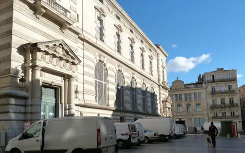 Historic building facade in Montpellier during a self-guided city exploration game.