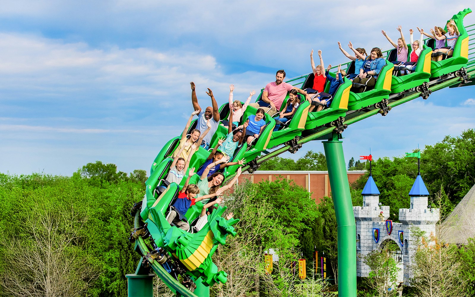 Visitors enjoying The Dragon rollercoaster at LEGOLAND Theme Park, Florida.