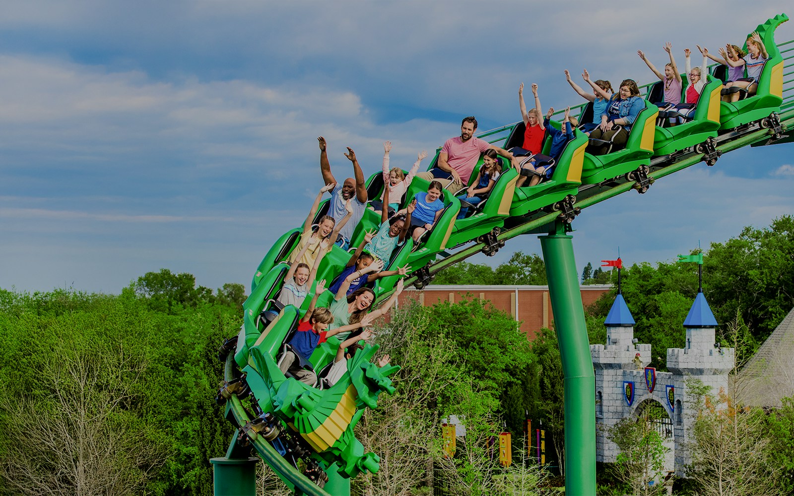 Visitors enjoying The Dragon rollercoaster at LEGOLAND Theme Park, Florida.