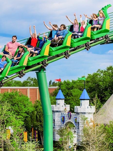Visitors enjoying The Dragon rollercoaster at LEGOLAND Theme Park, Florida.