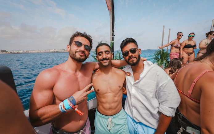 Tourists enjoying Cruise Crush Boat Party on the ocean.
