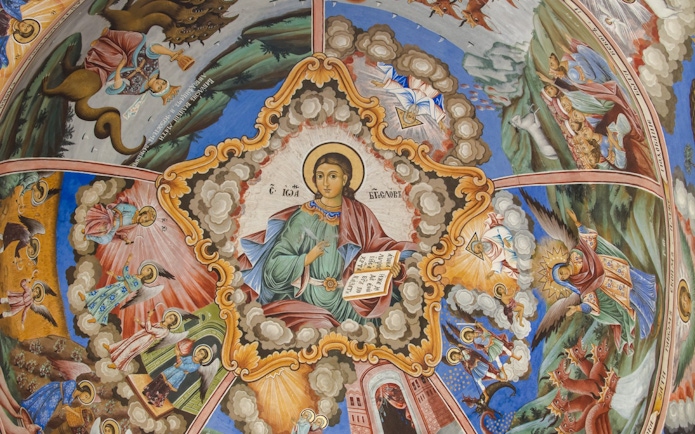 Religious frescoes depicting biblical scenes on the church wall in Rila Monastery, Bulgaria.