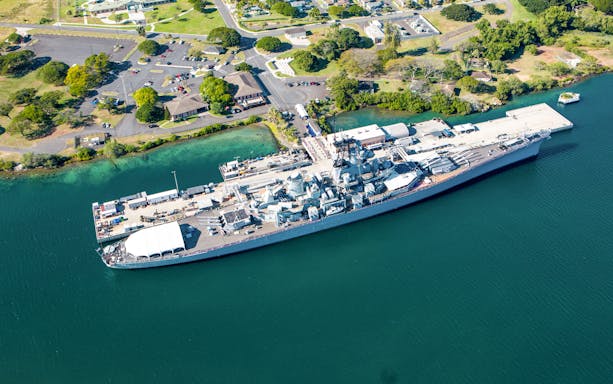 Battleship Missouri docked at Pearl Harbor, Oahu, viewed from above.