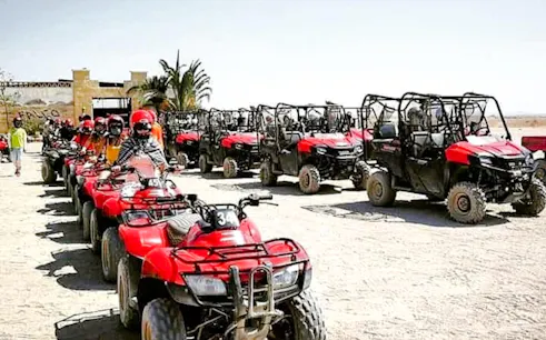 Quad bikes and buggies lined up for a family safari trip in Hurghada.