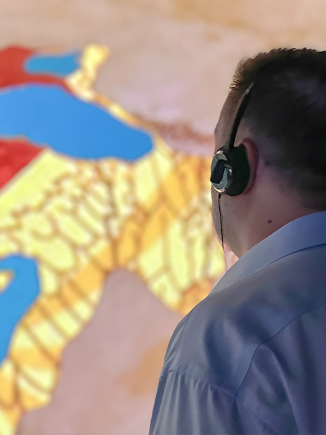 Person with headset viewing map during Hagia Sophia guided tour.