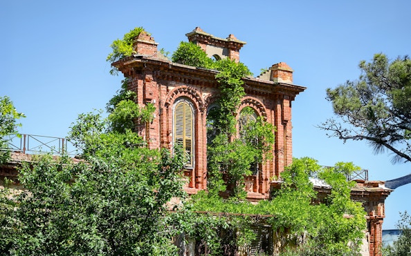 Ruins of Leon Trotsky's house with overgrown greenery on Buyukada Island, Istanbul.