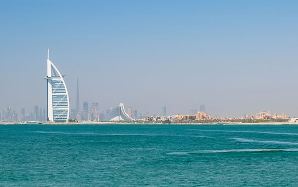 Burj Al Arab and Dubai skyline viewed from the sea, related to Jet Car Dubai tour.