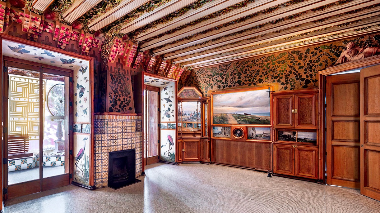 Casa Vicens dining room with intricate tile work and ornate wooden ceiling in Barcelona, Spain.