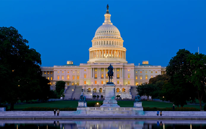 U.S. Capitol illuminated at night during a guided moonlight bus tour in Washington DC.