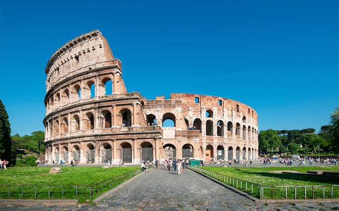 Colosseum facade with tourists, Rome, Italy.