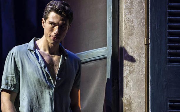 Man standing in a doorway, scene from "Aspects of Love" musical.