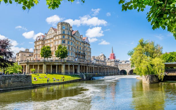 Historic architecture along the River Avon in Bath, England, featured in the Bridgerton Tour.