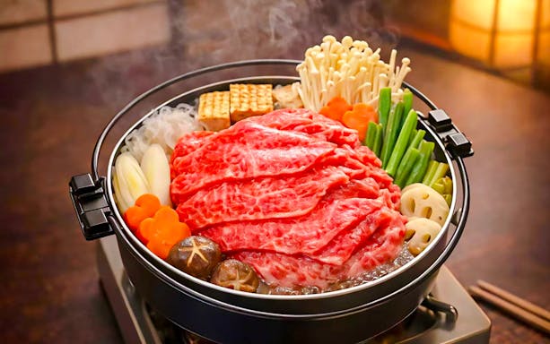 Traditional Japanese hot pot with beef and vegetables on Tokyo night tour.