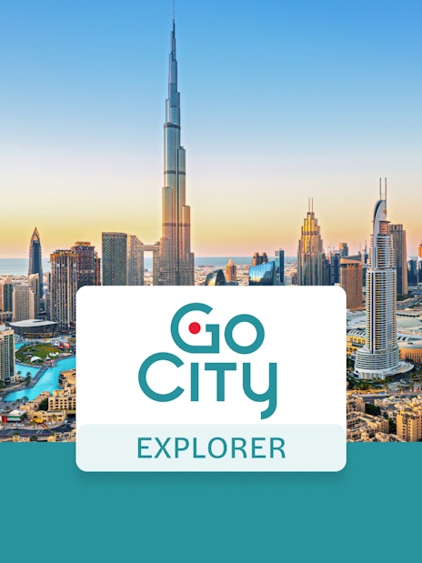 Dubai skyline with Burj Khalifa at sunset, promoting Go City: Dubai Explorer Pass.