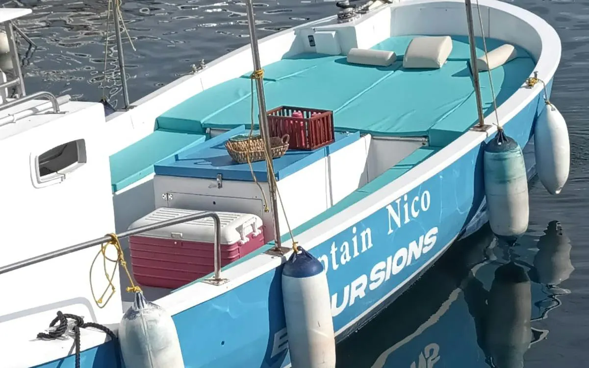 Boat prepared for Naples Posillipo Coast tour with snorkeling gear and Neapolitan tasting setup.
