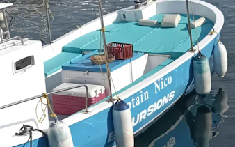 Boat prepared for Naples Posillipo Coast tour with snorkeling gear and Neapolitan tasting setup.