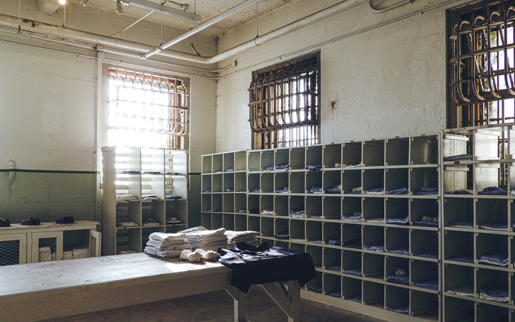 Alcatraz prison laundry room with shelves and barred windows in San Francisco.
