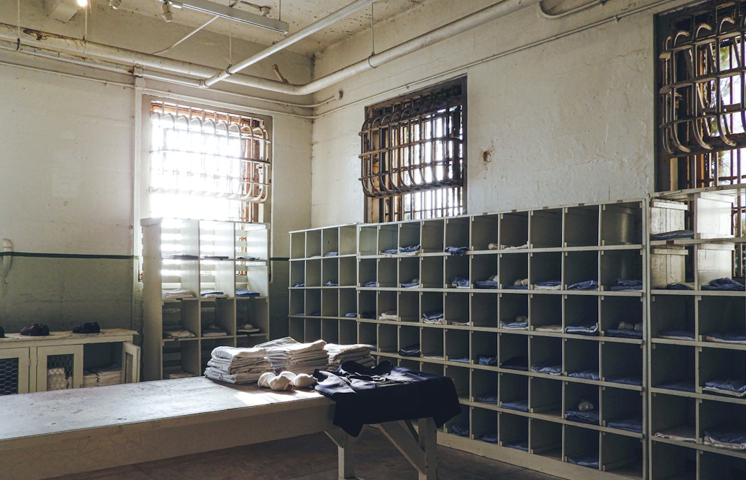 Alcatraz prison laundry room with shelves and barred windows in San Francisco.