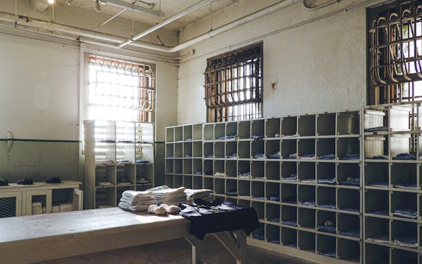 Alcatraz prison laundry room with shelves and barred windows in San Francisco.