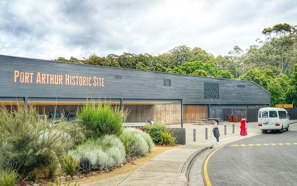 Port Arthur Historic Site entrance with visitors and shuttle bus.
