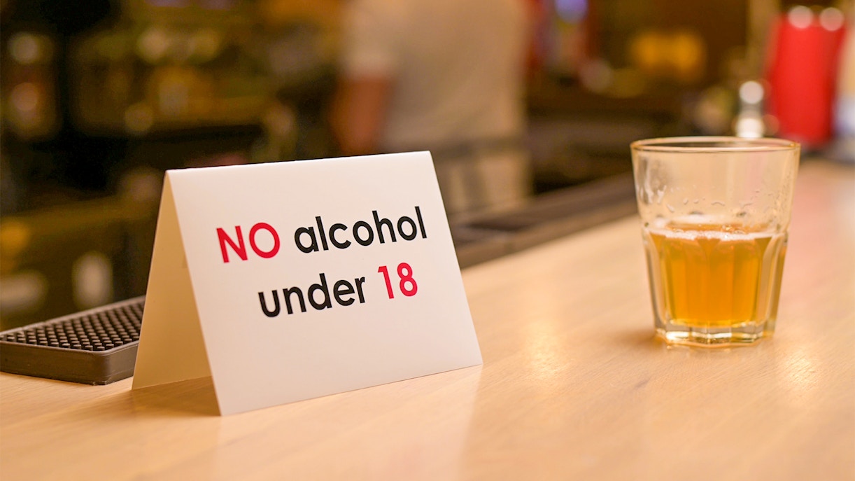 Beer tasting session with age limit sign at a bar in Munich, Germany.