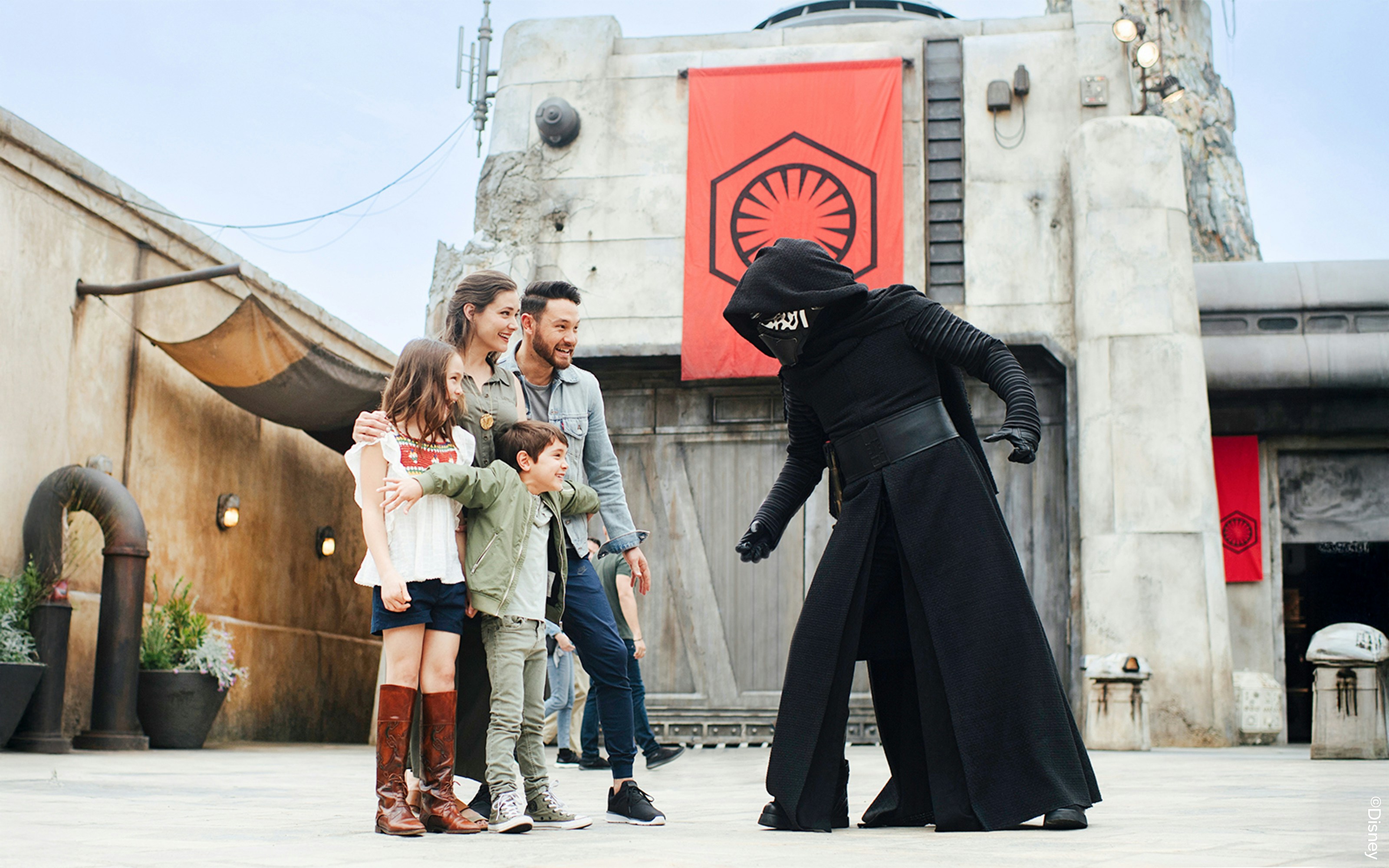 Guests interacting with a Star Wars character at Disneyland Park, California.