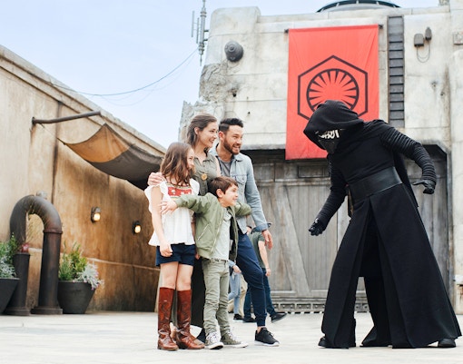 Guests interacting with a Star Wars character at Disneyland Park, California.