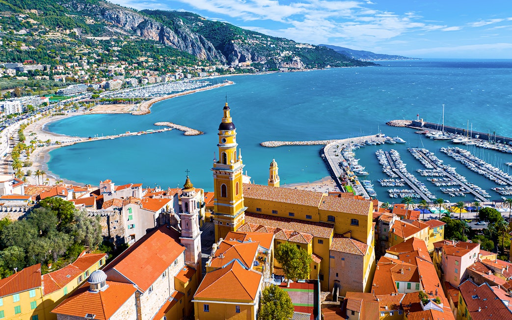 Aerial view of Menton with colorful buildings and marina on the Italian Riviera tour.