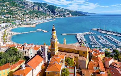 Aerial view of Menton with colorful buildings and marina on the Italian Riviera tour.