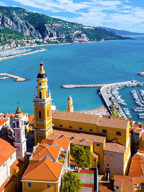 Aerial view of Menton with colorful buildings and marina on the Italian Riviera tour.