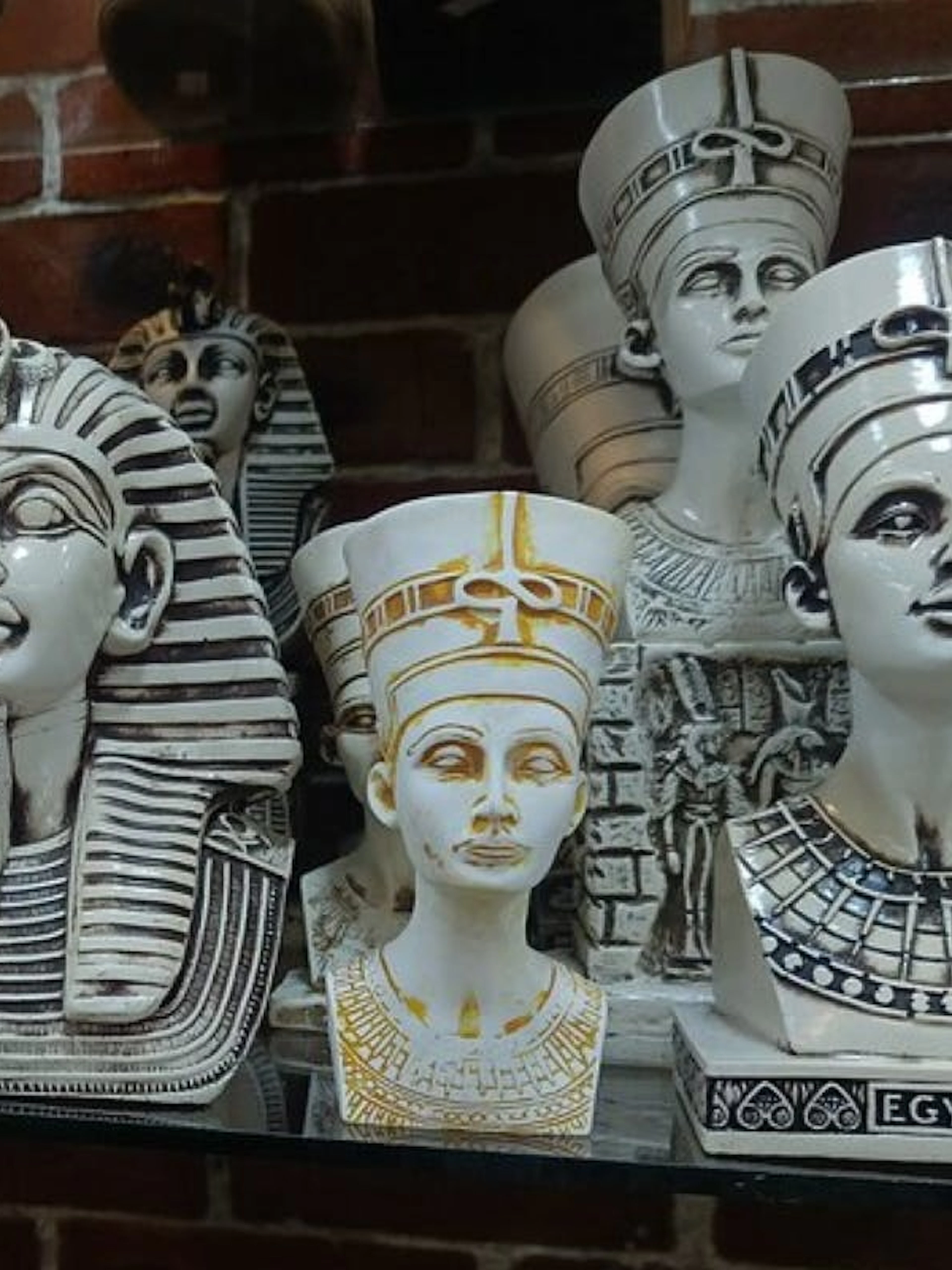 Ancient Egyptian pharaoh and queen busts on display in a Hurghada shop.