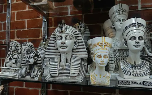 Ancient Egyptian pharaoh and queen busts on display in a Hurghada shop.
