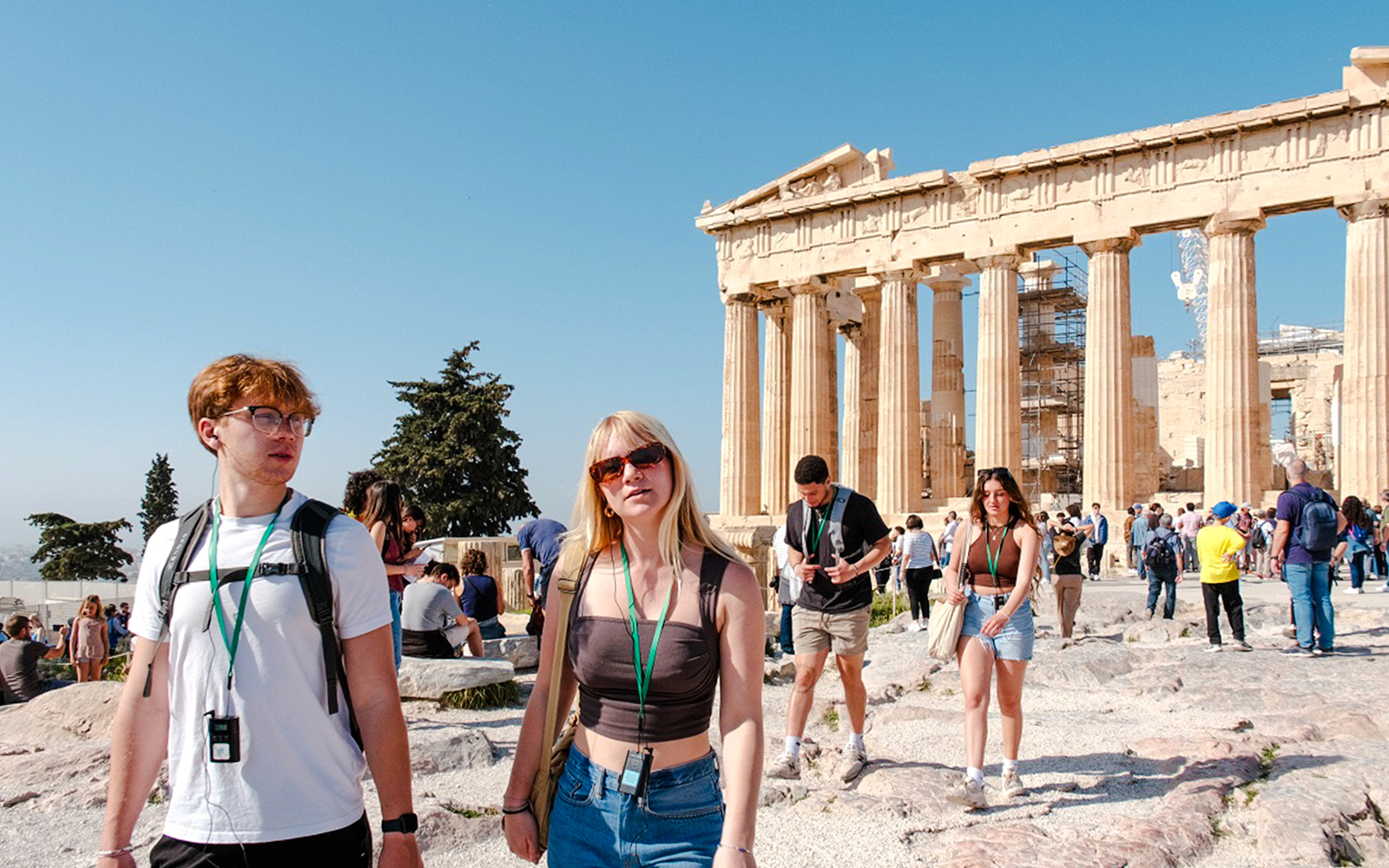 Guided tour group exploring the Parthenon in Athens, Greece.