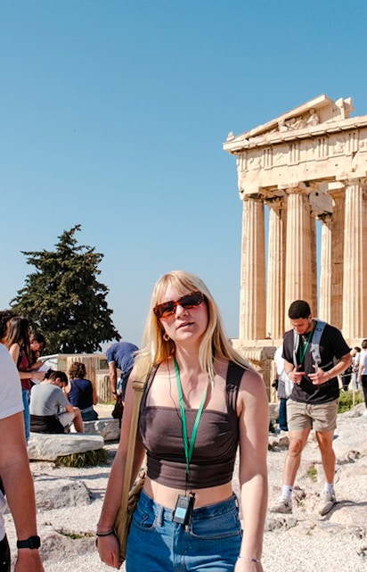 Guided tour group exploring the Parthenon in Athens, Greece.