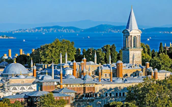 Topkapi Palace with Bosphorus view in Istanbul, showcasing historic architecture and scenic landscape.