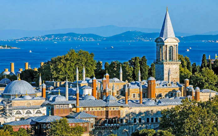 Topkapi Palace with Bosphorus view in Istanbul, showcasing historic architecture and scenic landscape.