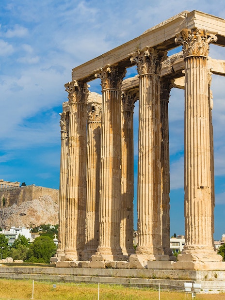 Ancient Temple of Zeus with Acropolis in background, Athens Hop on Hop off Tour.