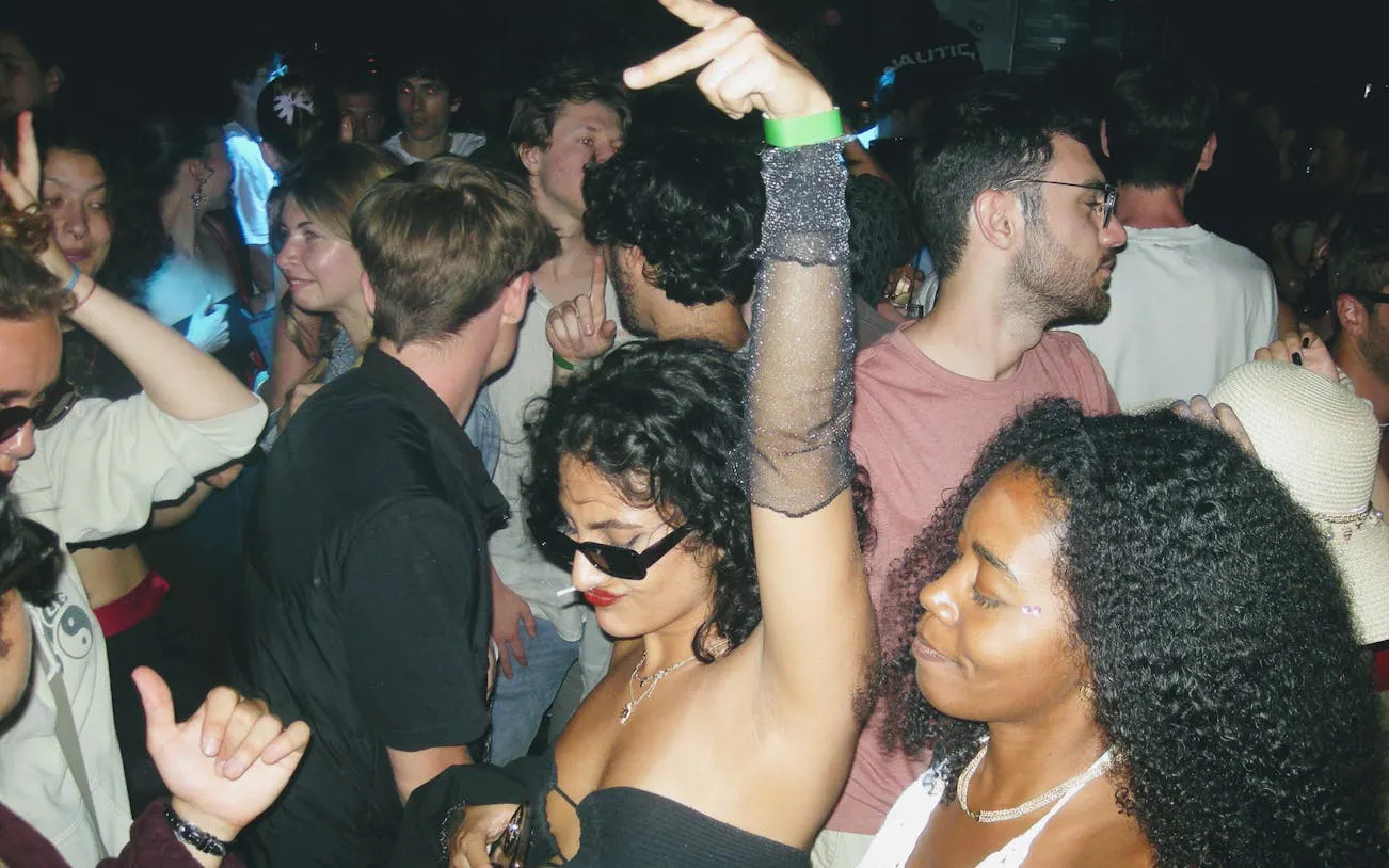 Crowd enjoying a lively night at a Barcelona club during a pub crawl.
