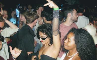 Crowd enjoying a lively night at a Barcelona club during a pub crawl.