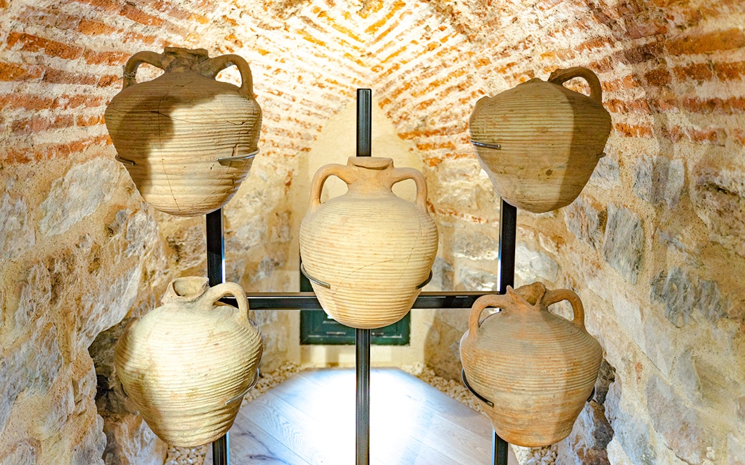 Ancient wine jugs displayed inside the Galata Tower, Istanbul.