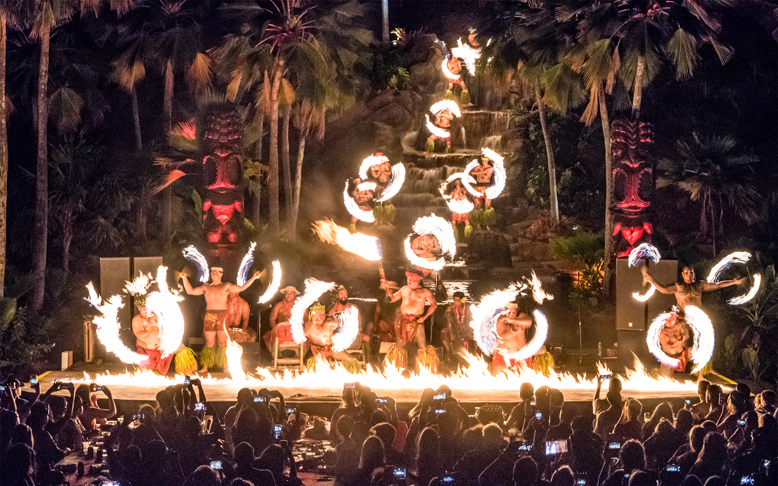 Performers at Chief's Luau Fire Waterfall finale with fire dance, Oahu, Hawaii.