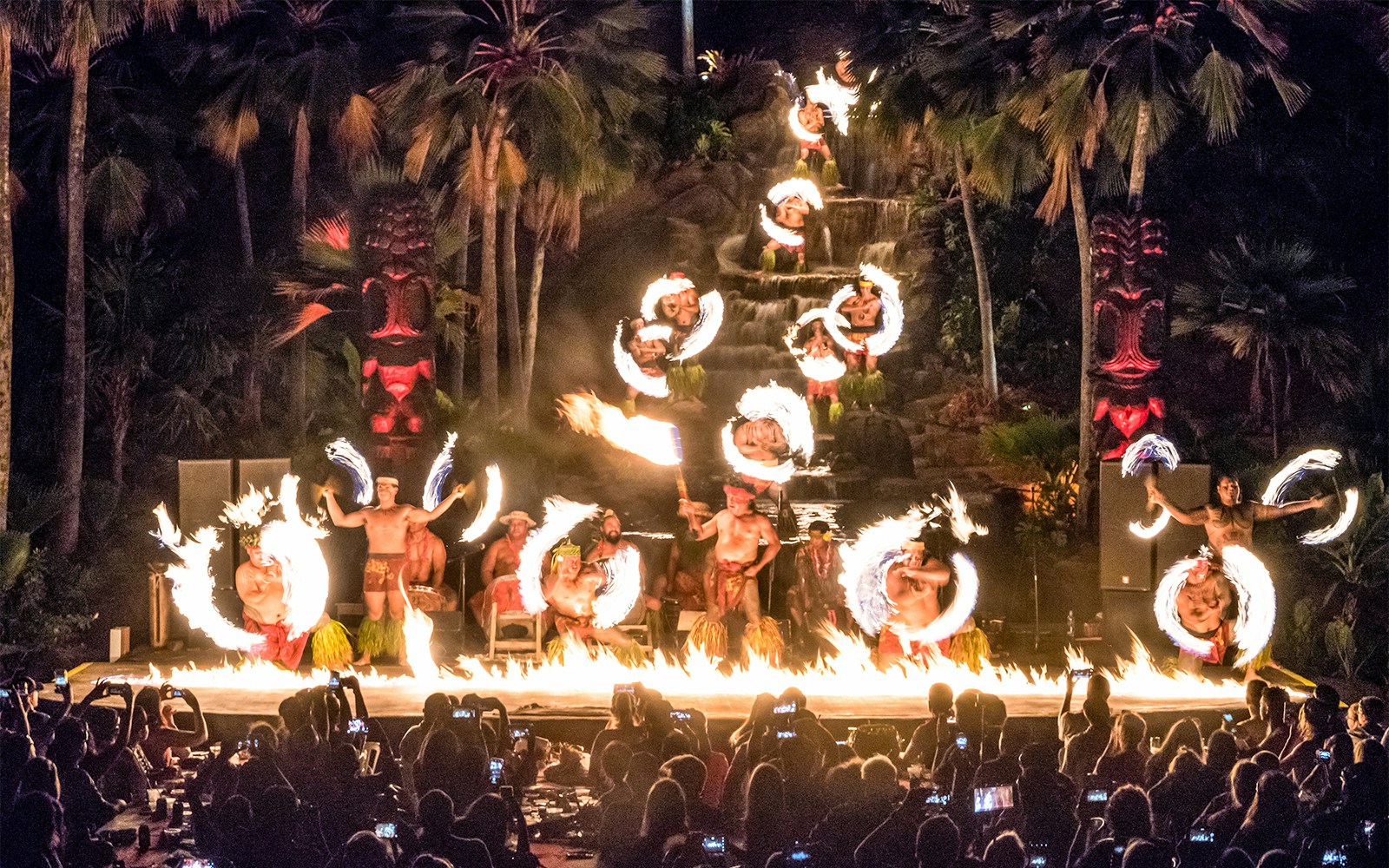 Performers at Chief's Luau Fire Waterfall finale with fire dance, Oahu, Hawaii.