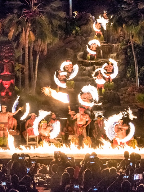 Performers at Chief's Luau Fire Waterfall finale with fire dance, Oahu, Hawaii.
