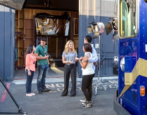 Tour guide giving guests information about the sets inside Universal Studios Hollywood