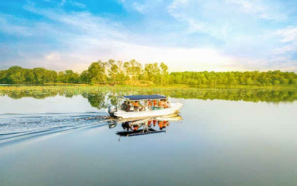 Boat tour on serene lake at Paya Indah Discovery Wetlands, Gamuda Cove.