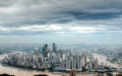 Chongqing skyline with Yangtze River and high-rise buildings, view from a private car tour.