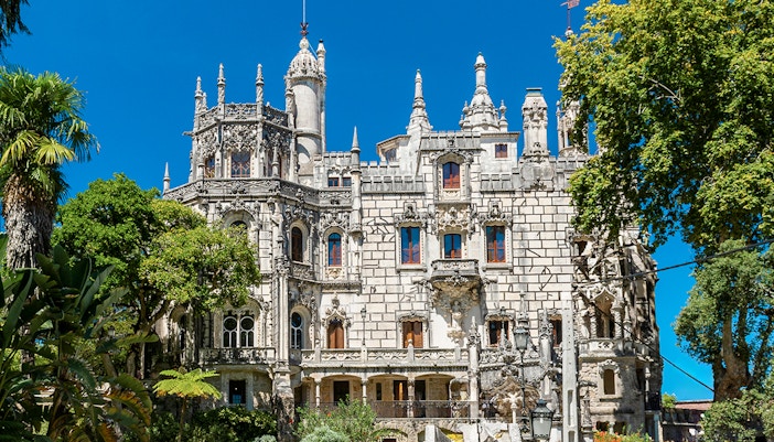 Quinta da Regaleira palace and gardens in Sintra, Portugal, showcasing Gothic architecture.